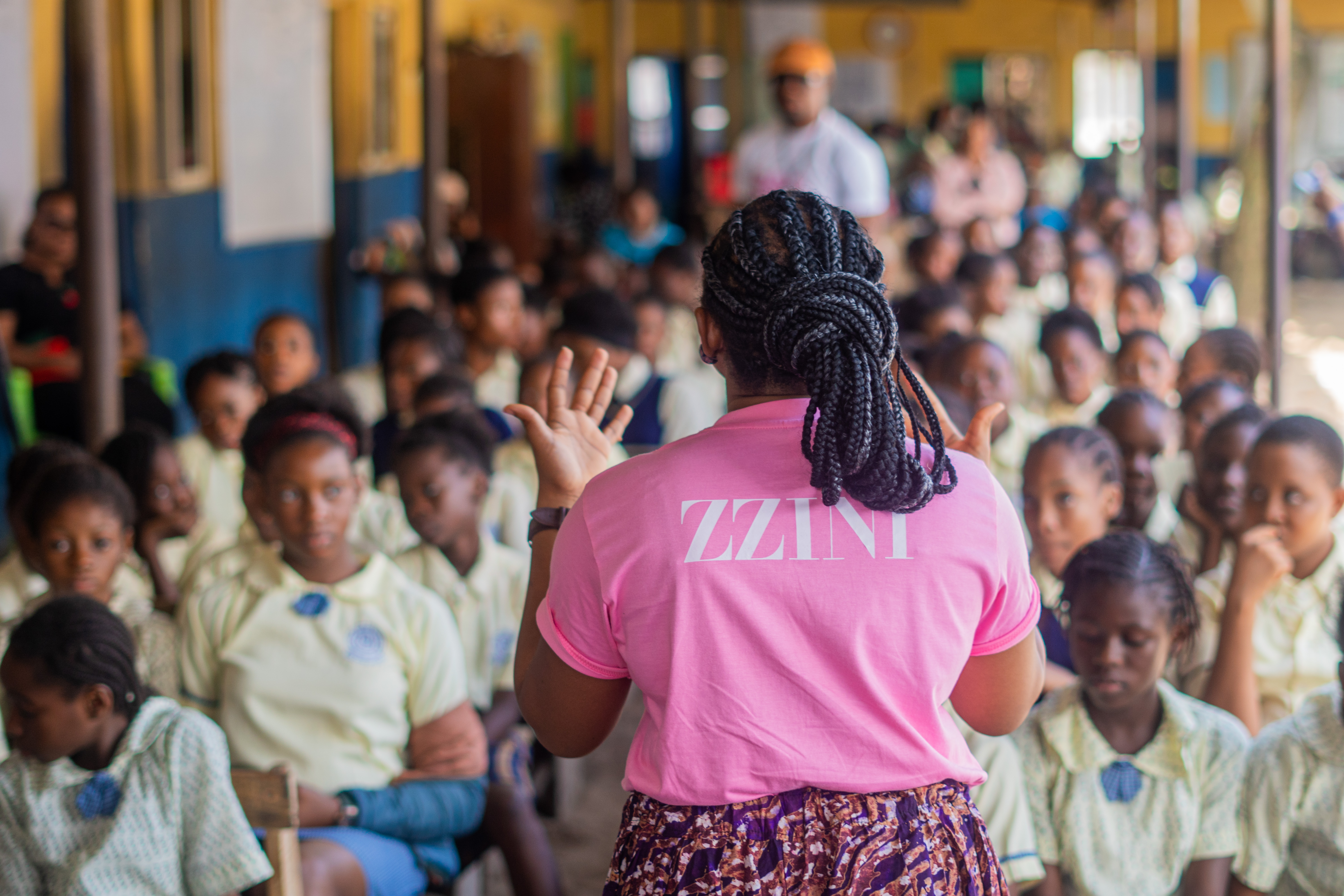 Zzini addressing girls at outreach